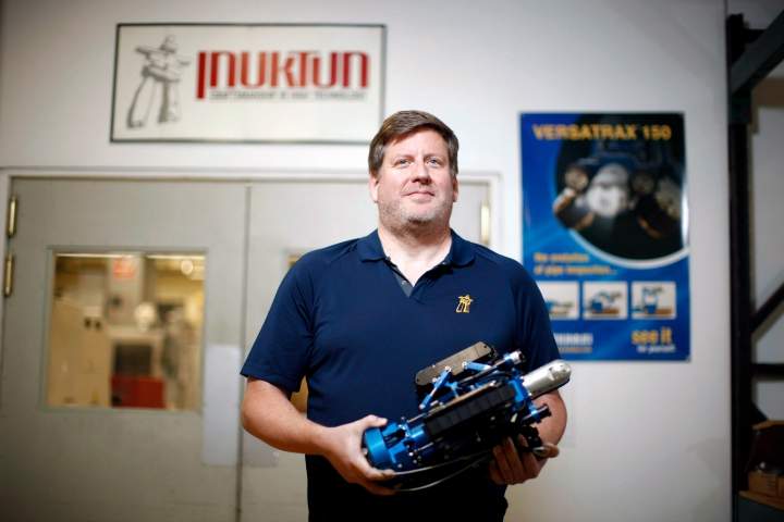 Colin Dobell, President and CEO of Inuktun, a maker of modular mobile robotic crawler vehicles, based in Nanaimo, B.C., Wednesday, August 5, 2015. Colin holds a Versatrax Vertical Crawler.