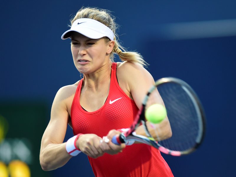 ugenie Bouchard, of Canada, returns to Belinda Bencic, of Switzerland, during tennis action at Rogers Cup in Toronto on Tuesday, August 11, 2015. 