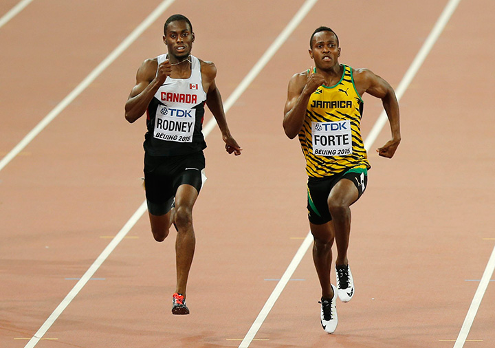 Canada's Brendon Rodney, left, and Jamaica's Julian Forte compete in a men's 200m heat during the World Athletics Championships at the Bird's Nest stadium in Beijing, Tuesday, Aug. 25, 2015. 