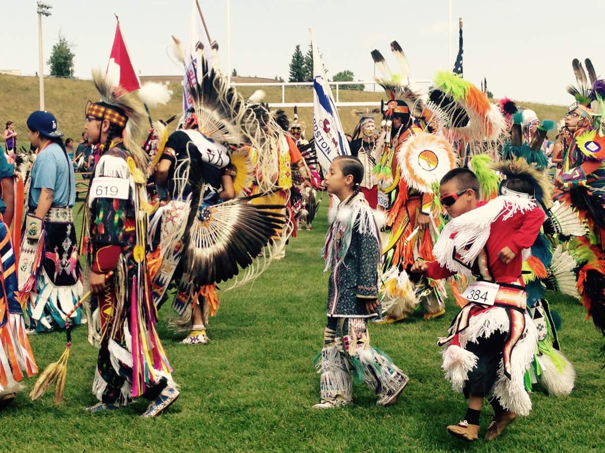 Dancers enter the ring during the grand entry of the Cardston-Kainai Pow Wow.