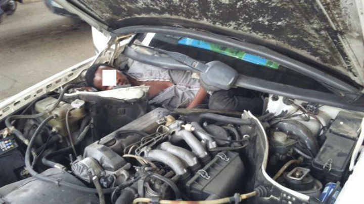 Agents of Spain's Guardia Civil found a man in the "fetal position" crammed into a specially designed compartment next to the engine of a car trying to cross into the North African enclave of Ceuta. 