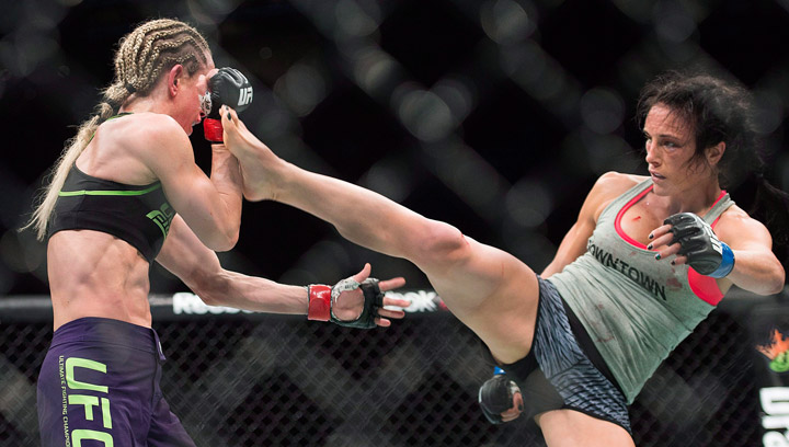 Valerie Letourneau, right, lands a kick to the head of Jessica Rakoczy, during their UFC 186 fight in Montreal, Saturday, April 25, 2015.  Letourneau is looking for her third win at UFC Fight Night Saskatoon.