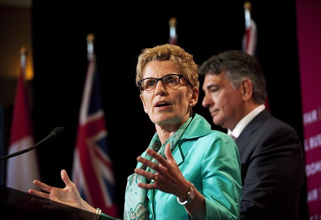 Ontario Premier Kathleen Wynne and Finance Minister Charles Sousa are shown in Toronto on Tuesday June 11, 2013.