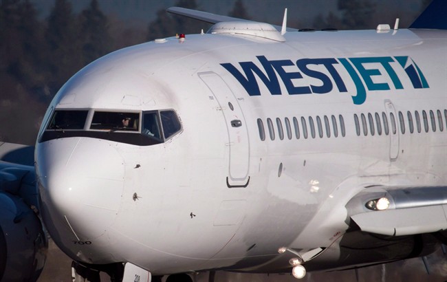 A Westjet Boeing 737-700 plane arrives at Vancouver International Airport.