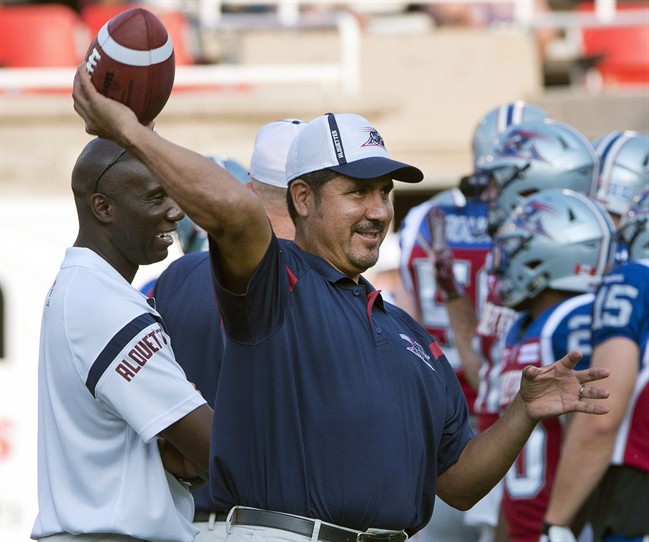 In this 2015 file photo, Montreal Alouette quarterback coach Anthony Calvillo loosens up before the game against the Calgary Stampeders. Calvillo will be joining the university ranks as assistant coach for Montreal Carabins  in 2019.