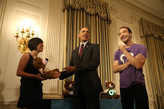 President Barack Obama meets with Aaron Horowitz and Hannah Chung, Providence, R.I., of Sproutel as he hosts top innovators and startup founders from across the country for the first White House Demo Day, Aug. 4, 2015, in the State Dinning Room of the White House in Washington. Chung holds Jerry the bear is a smart stuffed animal with educational apps that help kids build healthy behaviors centered on nutrition, exercise, sleep, and mindfulness.