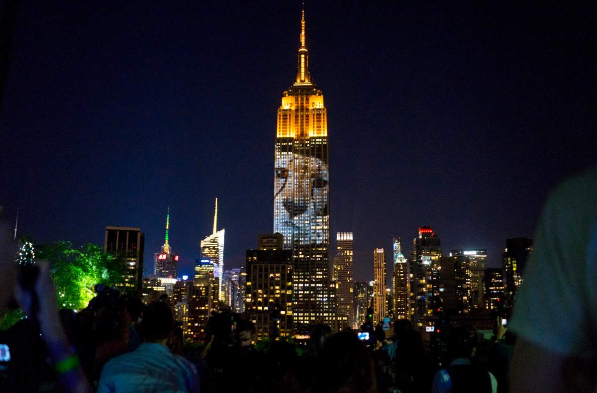Large images of endangered species are projected on the south facade of The Empire State Building, Saturday, Aug. 1, 2015, in New York. The large scale projections are in part inspired by and produced by the filmmakers of an upcoming documentary called “Racing Extinction.”