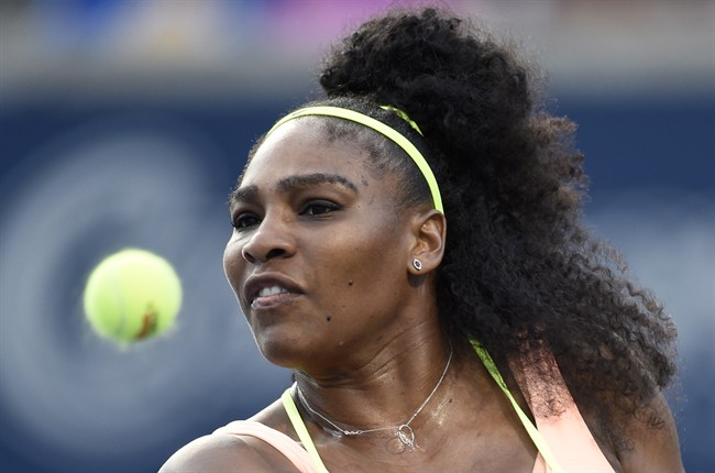 Serena Williams, of the US, returns to Andrea Petkovic, of Germany, during round of 16 tennis action at the Rogers Cup in Toronto on Thursday, August 13, 2015.