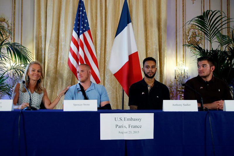 From left, U.S. Ambassador to France Jane D. Hartley, U.S. Airman Spencer Stone, Anthony Sadler, a senior at Sacramento University in California and Alek Skarlatos attend a press conference held at the US Ambassador’s residence in Paris, France, Sunday, Aug. 23, 2015.