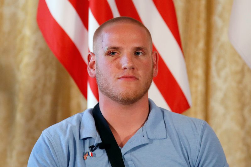 U.S. Airman Spencer Stone attends a press conference held at the U.S. Ambassador’s residence with Anthony Sadler, a senior at Sacramento University in California, U.S. National Guardsman from Roseburg, Oregon, with Alek Skarlatos with Jane D. Hartley, U.S. Ambassador to France, in Paris, France, Sunday, Aug. 23, 2015.