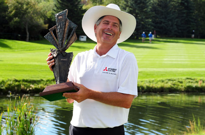 Fred Couples laughs as he holds the trophy after winning the Shaw Charity Classic at the Canyon Meadows Golf & Country Club on August 31, 2014 in Calgary. Couples won the tournament in a playoff with Billy Andrade.