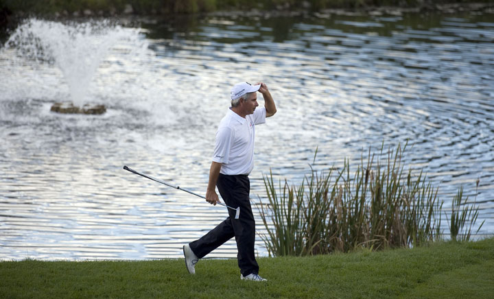 Fred Couples walks to the 18th green during his playoff with Billy Andrade after the final round of the Shaw Charity Classic at the Canyon Meadows Golf & Country Club on August 31, 2014 in Calgary.