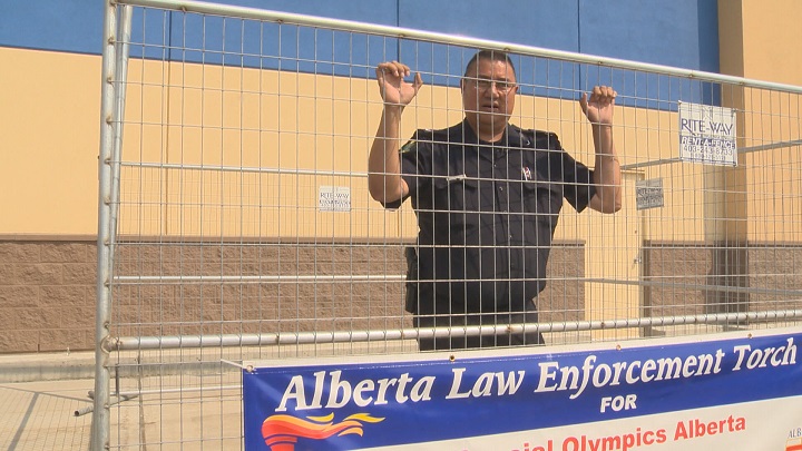 Cst. Les Vonkeman waits behind bars at Free The Fuzz.