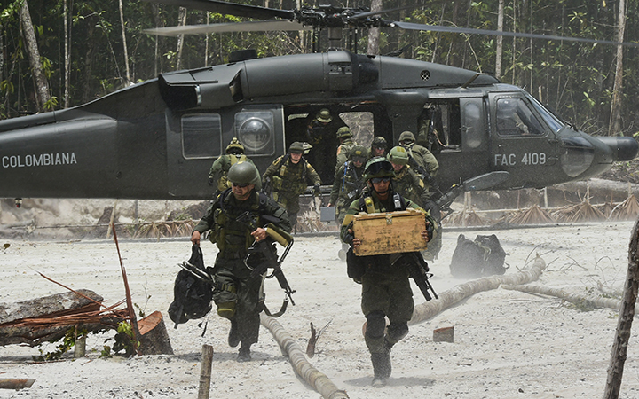 Colombian police exit a Black Hawk helicopter on May 5, 2015.