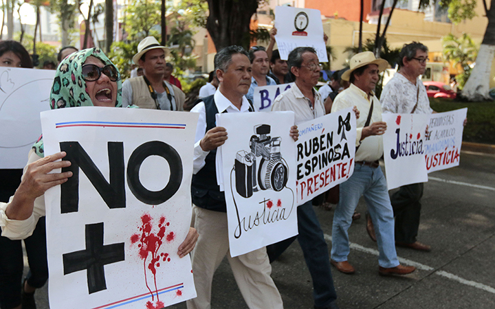 Mexican journalists take part a demonstration protesting for the murder of photojournalist Ruben Espinosa, in Acapulco, Guerrero state, Mexico, on August 4, 2015.