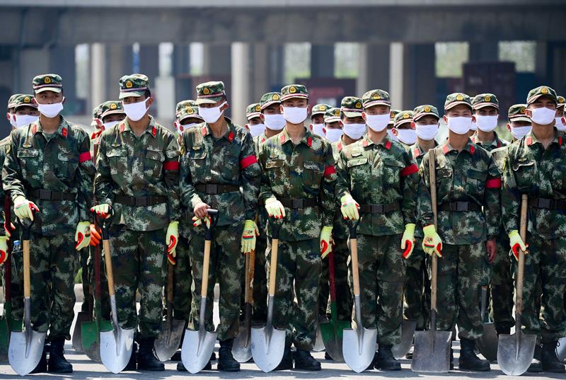 Rescuers are seen at the site of the massive explosions in Tianjin on August 13, 2015.