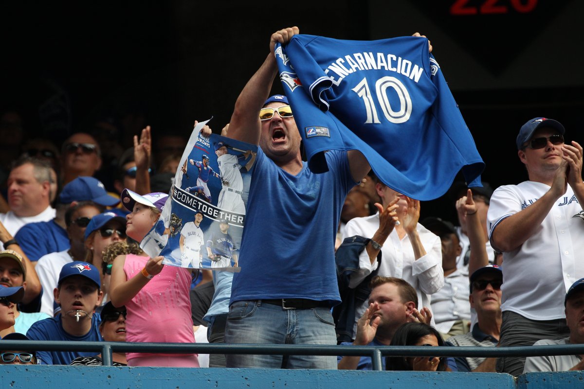 A fan waves an Edwin Encarnacion jersey during MLB action against the Detroit Tigers at the Rogers Centre in Toronto.  
