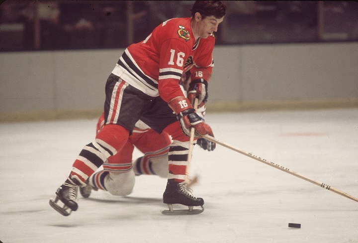 Canadian professional ice hockey player Ronald 'Chico' Maki #16 of the Chicago Blackhawks skates over an opponent on the ice during a game against the New York Rangers, Madison Square Garden, New York. Maki played for Chicago from 1961 to 1976. (Photo by Melchior DiGiacomo/Getty Images).