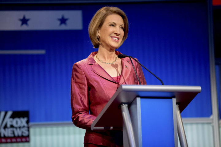 Republican presidential candidate businesswoman Carly Fiorina stands on stage for a pre-debate forum at the Quicken Loans Arena, Thursday, Aug. 6, 2015, in Cleveland. Seven of the candidates have not qualified for the primetime debate.