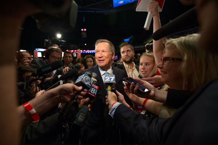 Republican presidential candidate Ohio Gov. John Kasich speaks to members of the media in the spin room following the first Republican presidential debate at the Quicken Loans Arena, Thursday, Aug. 6, 2015, in Cleveland.