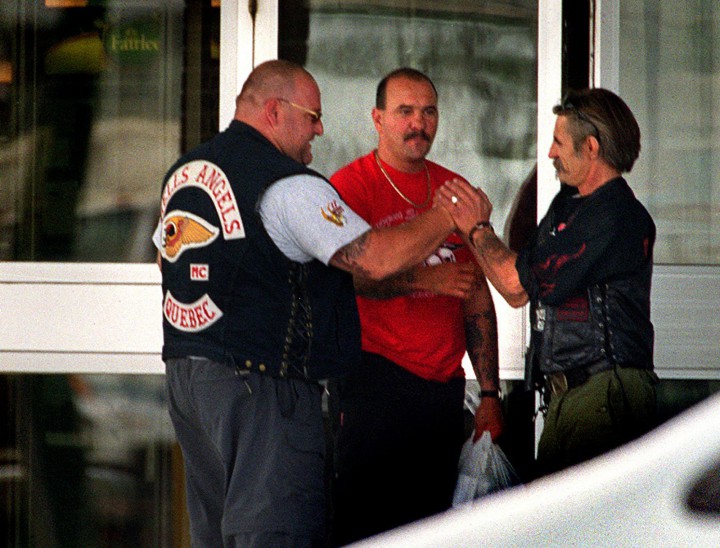 A member of the Hells Angels motorcycle gang Quebec chapter (left) is greeted outside a hotel by a member of the Los Bravos in Winnipeg Friday July 21, 2000.