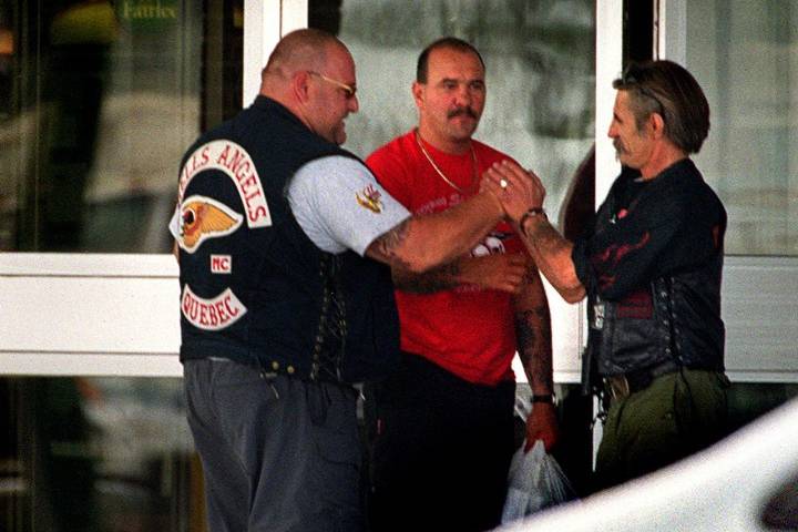  member of the Hells Angels motorcycle gang Quebec chapter (left) is greeted outside a hotel by a member of the Los Bravos in Winnipeg Friday July 21, 2000.
CP PHOTO/The Winnipeg Free Press-Phil Hossack.