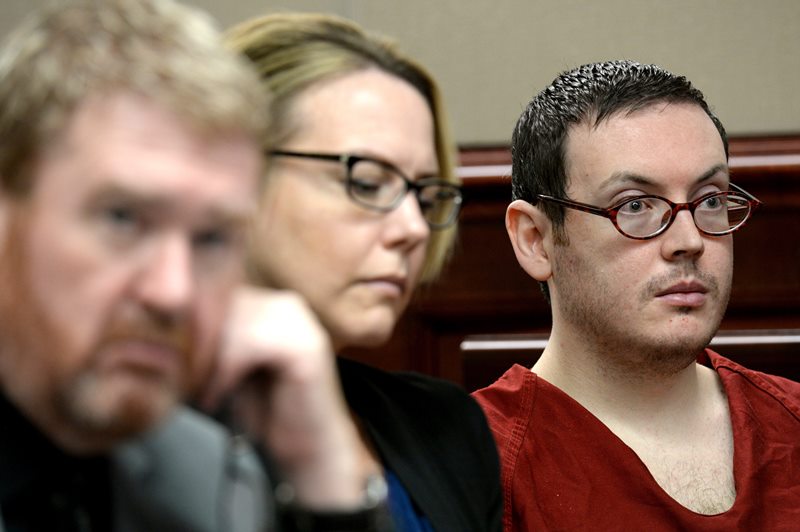 Defense attorneys Daniel King, left, and Katherine Spengler, sits at a table with James Holmes, right, as he appears in court for the sentencing phase of his trial Tuesday, Aug. 25, 2015, at Arapahoe County District Court in Centennial, Colo. 