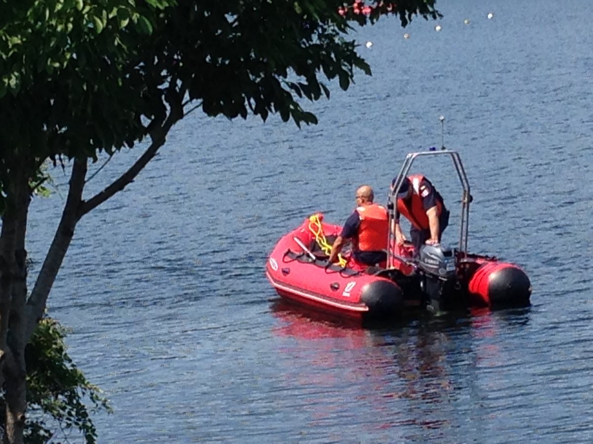 Halifax Fire officials help to search Lake Banook for a missing swimmer.