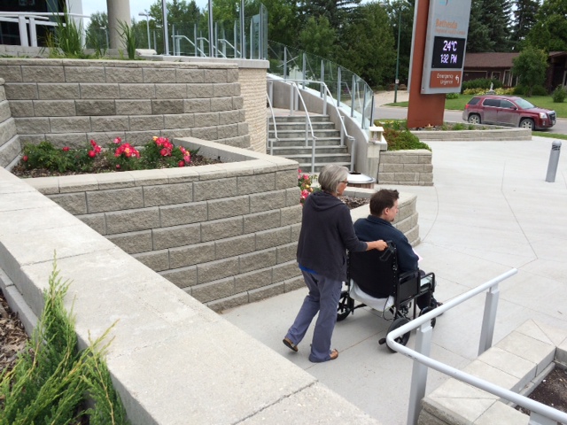 Patients going in to the hospital have to either walk up a set of 14 steep stairs or a long narrow steep ramp. 