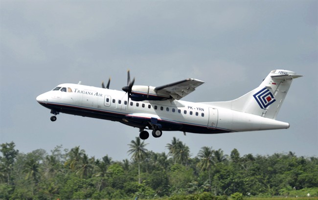 In this photo taken Dec. 26, 2010, Trigana Air Service's ATR42-300 twin turboprop plane takes off at Supadio airport in Pontianak, West Kalimantan, Indonesia. The same type of a Trigana airliner carrying 54 people was missing Sunday, Aug. 16, 2015 after losing contact with ground control during a short flight in bad weather in the country's mountainous easternmost province of Papua, officials said. A search for the plane was suspended and will resume Monday morning.
