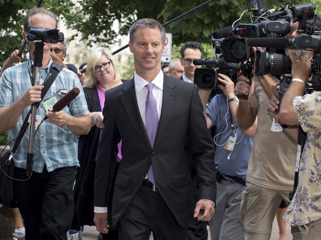 Nigel Wright, former chief of staff to Prime Minister Stephen Harper, arrives at the Ottawa courthouse in Ottawa Wednesday, Aug. 19, 2015 to testify at the Mike Duffy trial. 