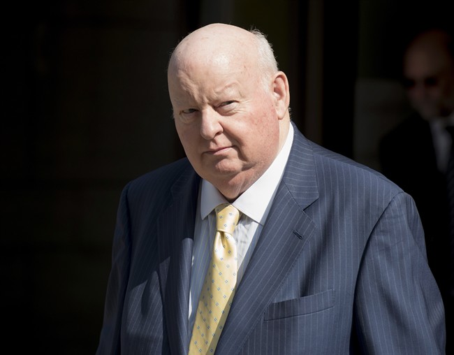 Former Conservative senator Mike Duffy leaves the courthouse in Ottawa on Wednesday, Aug. 19, 2015. Duffy is facing 31 charges of fraud, breach of trust, bribery, frauds on the government related to inappropriate Senate expenses. 