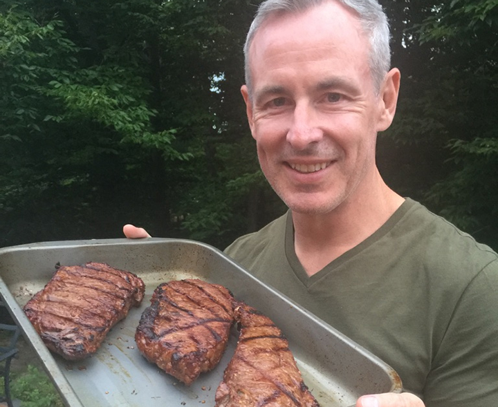 Jeff McArthur shows off his BBQ skills with some spicy steaks.