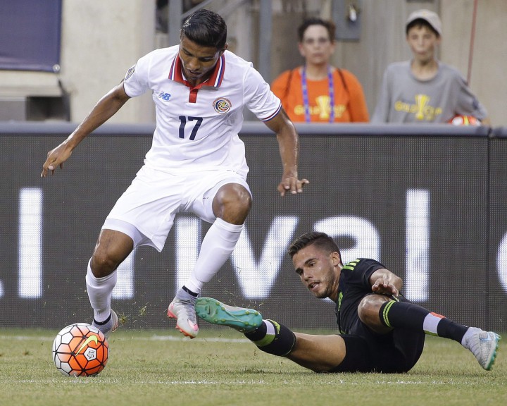 Mexico's Miguel Layun (7) and Costa Rica's Johan Venegas (17) fight for control of the ball during the first half of a CONCACAF Gold Cup soccer match Sunday, July 19, 2015, at MetLife stadium in East Rutherford, N.J.