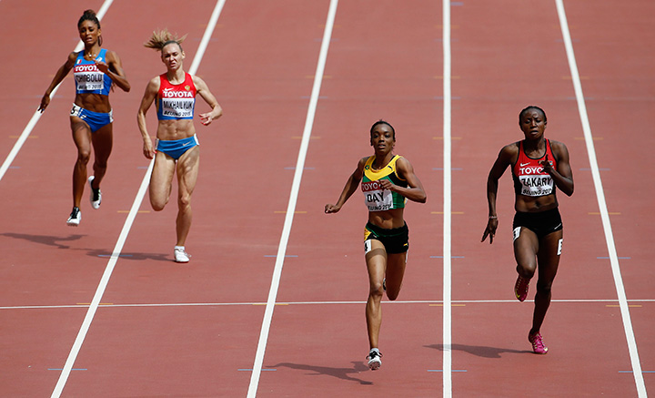 Jamaica's Christine Day, second right, races alongside Kenya's Joyce Zakary, right, in round one of the women's 400m at the World Athletics Championships at the Bird's Nest stadium in Beijing, Monday, Aug. 24, 2015. 