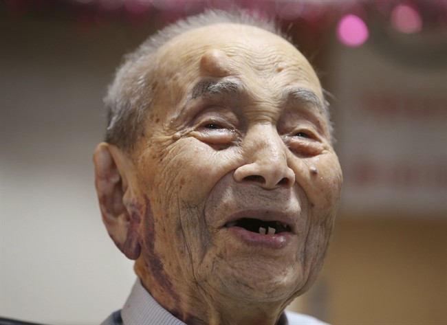 Yasutaro Koide, the 112-year-old living in the central Japanese city of Nagoya, smiles upon being formally recognized as the world's oldest man by the Guinness World Records at a nursing home in Nagoya Friday, Aug. 21, 2015. Koide was born on March 13, 1903 and worked as a tailor when he was younger. He became the world’s oldest man with the death of Sakari Momoi of Tokyo in July at age 112. (AP Photo/Koji Sasahara).