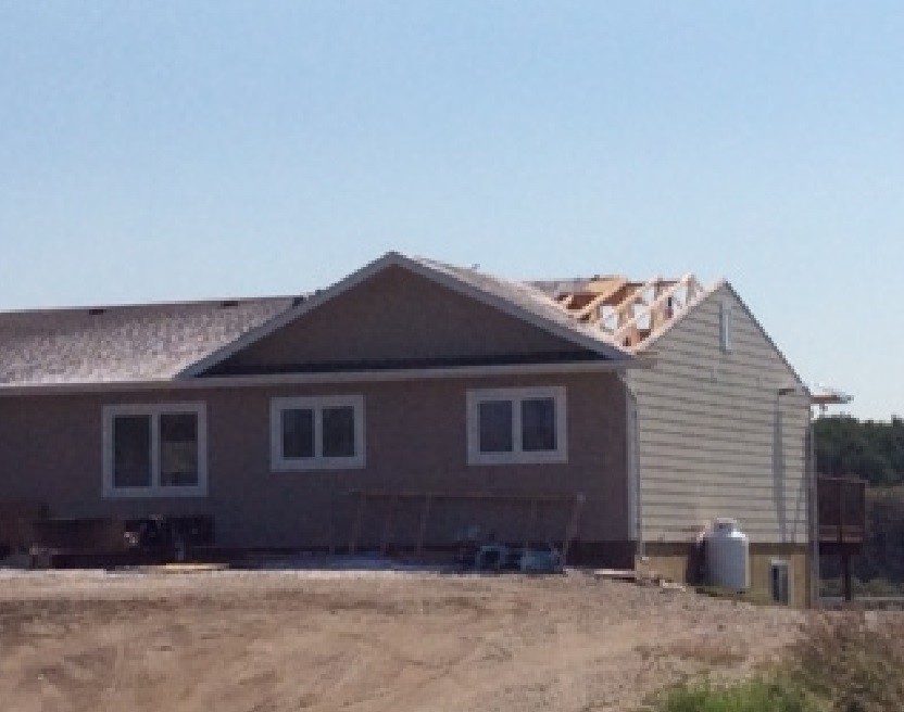 Environment Canada believes this house was hit by a rare weather occurrence that destroyed it's roof.