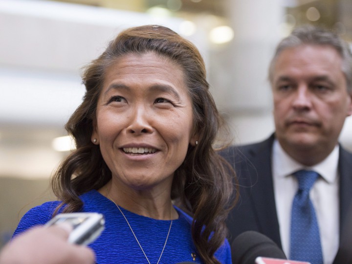 Lu Chan Khuong, the suspended head of the Quebec Bar association, arrives at the courthouse with her lawyer Jean-Francois Bertrand Thursday, August 20, 2015 in Quebec City.
