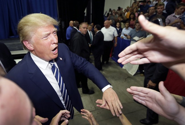 Republican presidential candidate Donald Trump meets supporters after addressing a GOP fundraising event, Tuesday, Aug. 11, 2015, in Birch Run, Mich. Trump attended the Lincoln Day Dinner of the Genesee and Saginaw county Republican parties.