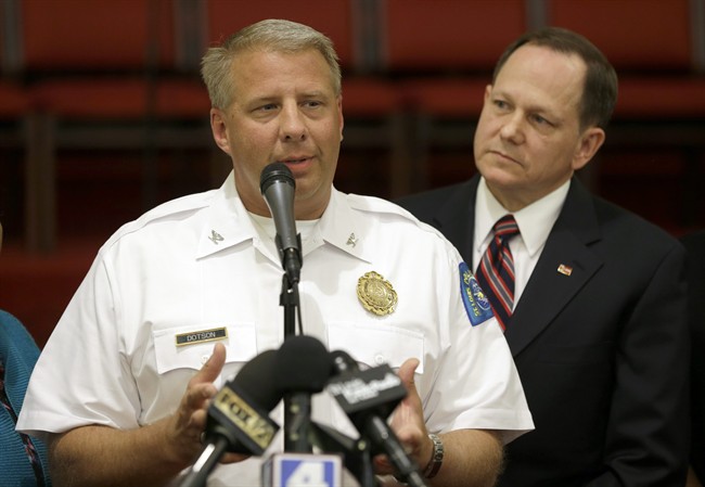 St. Louis police chief Sam Dotson, left, appeals for calm alongside mayor Francis Slay, Thursday, Aug. 20, 2015, West Side Missionary Baptist Church in St. Louis. 