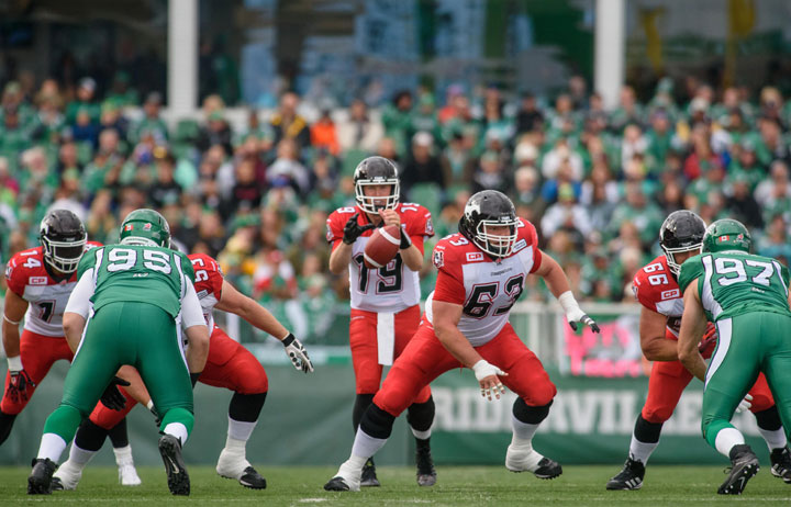 Calgary Stampeders quarterback Bo Levi Mitchell (#19) takes the snap during first half CFL action in Regina on Saturday, August 22, 2015.