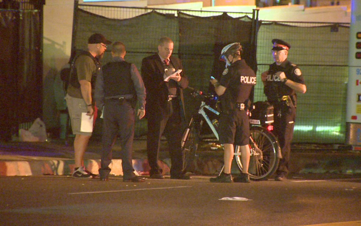 Police gather outside the scene of the Muzik nightclub shooting .