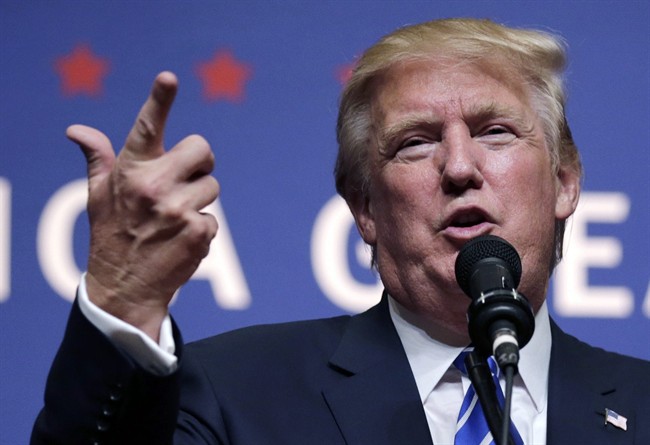Republican presidential candidate Donald Trump gestures during a campaign stop at Winnacunnet High School in Hampton, N.H., Friday, Aug. 14, 2015.