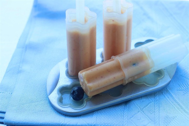 This Aug. 3, 2015 photo shows peach blueberry frozen pops in Concord, NH.This easy recipe for peach-blueberry frozen pops is a great way to use some of your frozen fruit stash any time of year.