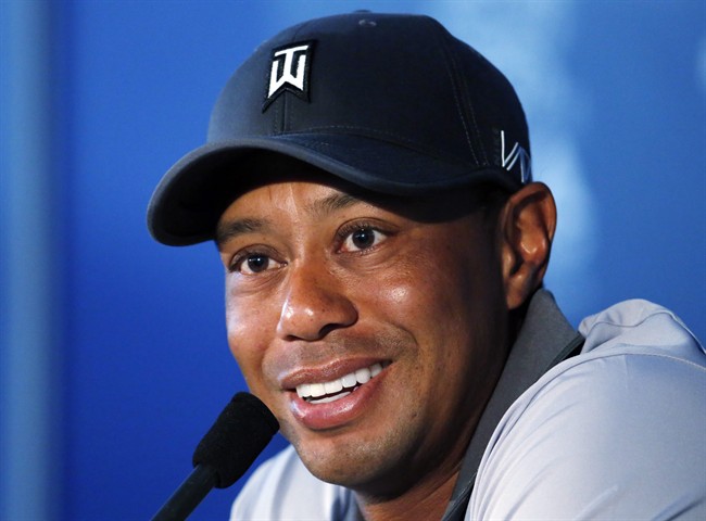 In this Aug. 11, 2015 file photo, Tiger Woods talks in the media room after a practice round for the PGA Championship golf tournament at Whistling Straits in Haven, Wis. 