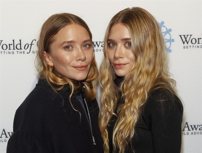 Mary-Kate Olsen, left, and Ashley Olsen are seen in this Thursday, Nov. 6, 2014 file photo in New York. 