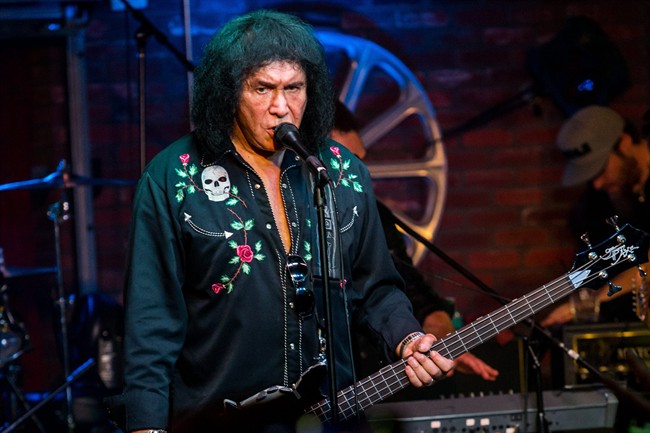 In this Aug. 16, 2015, file photo, Gene Simmons performs during the "Music On A Mission" benefit concert held at Lucky Strike Live - Hollywood in Los Angeles.