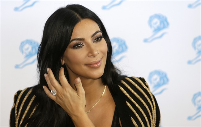 In this June 24, 2015 file photo, American television personality Kim Kardashian poses for photographers as she attends the Cannes Lions 2015 in Cannes, southern France. 