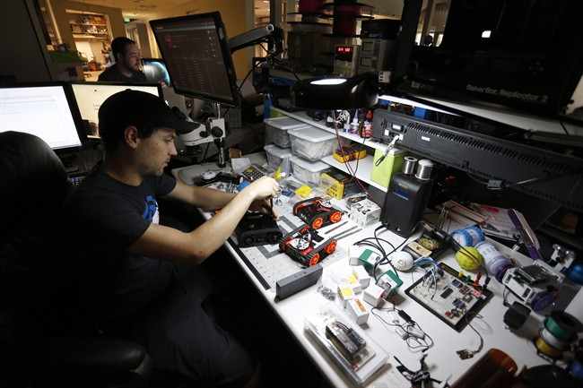 In this July 24, 2015 photo, Sphero co-founder and CTO Ian Bernstein works on a project at the fast-growing toy robotics company Sphero, in Boulder, Colo. The company has collaborated with Lucasfilm-parent Disney to develop the BB-8, a droid character which will be featured in “Star Wars: Episode VII - The Force Awakens.”.