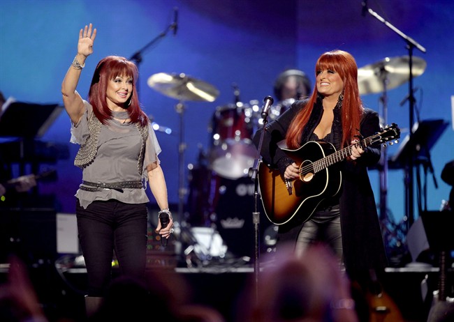 FILE - In this April 4, 2011 file photo, The Judds, Naomi Judd, left, and Wynonna Judd perform at the Girls' Night Out: Superstar Women of Country in Las Vegas.